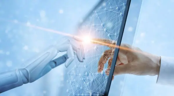 A robot hand and a human hand touch through a digital interface, symbolizing technology and human interaction.