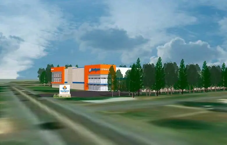 Illustration of an orange and white self-storage building surrounded by trees and a sign in a grassy area under a cloudy sky.