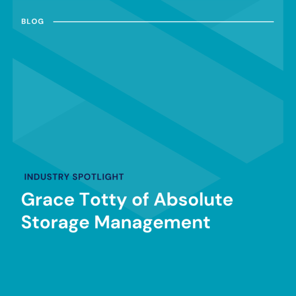 A blog graphic with the title "Industry Spotlight: Grace Totty of Absolute Storage Management" on a blue background with geometric shapes.