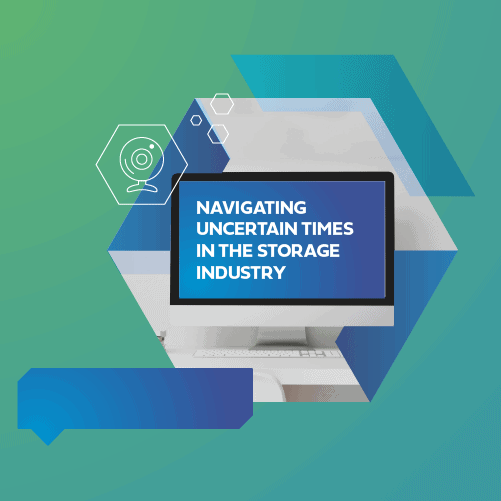 Hexagonal design with a computer screen displaying the text: "Navigating Uncertain Times in the Storage Industry", on a green and blue gradient background.