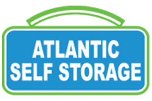 Blue and green Atlantic Self Storage sign with white text.