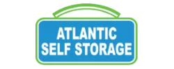 A rectangular blue and green sign displays the words "Atlantic Self Storage" in bold white letters.